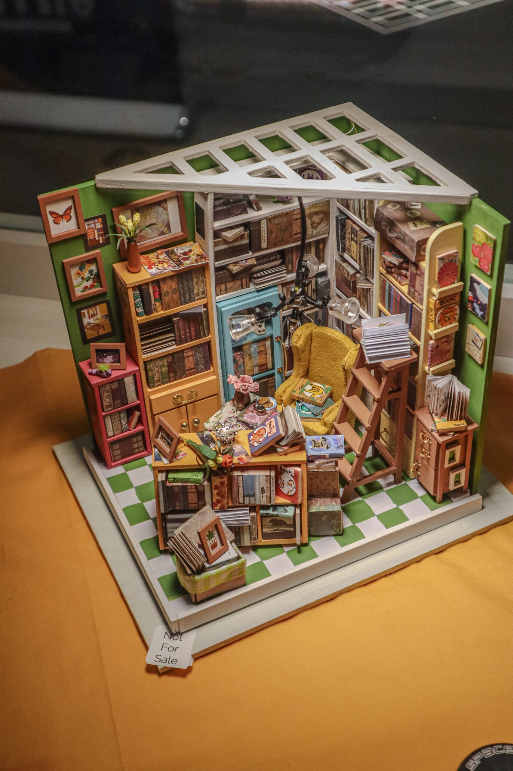 Simon's library became Daikoku's Bookstore. At the time, I was listening to quite a bit of Pratchett, which is why you'll spot so many Discworld references. 