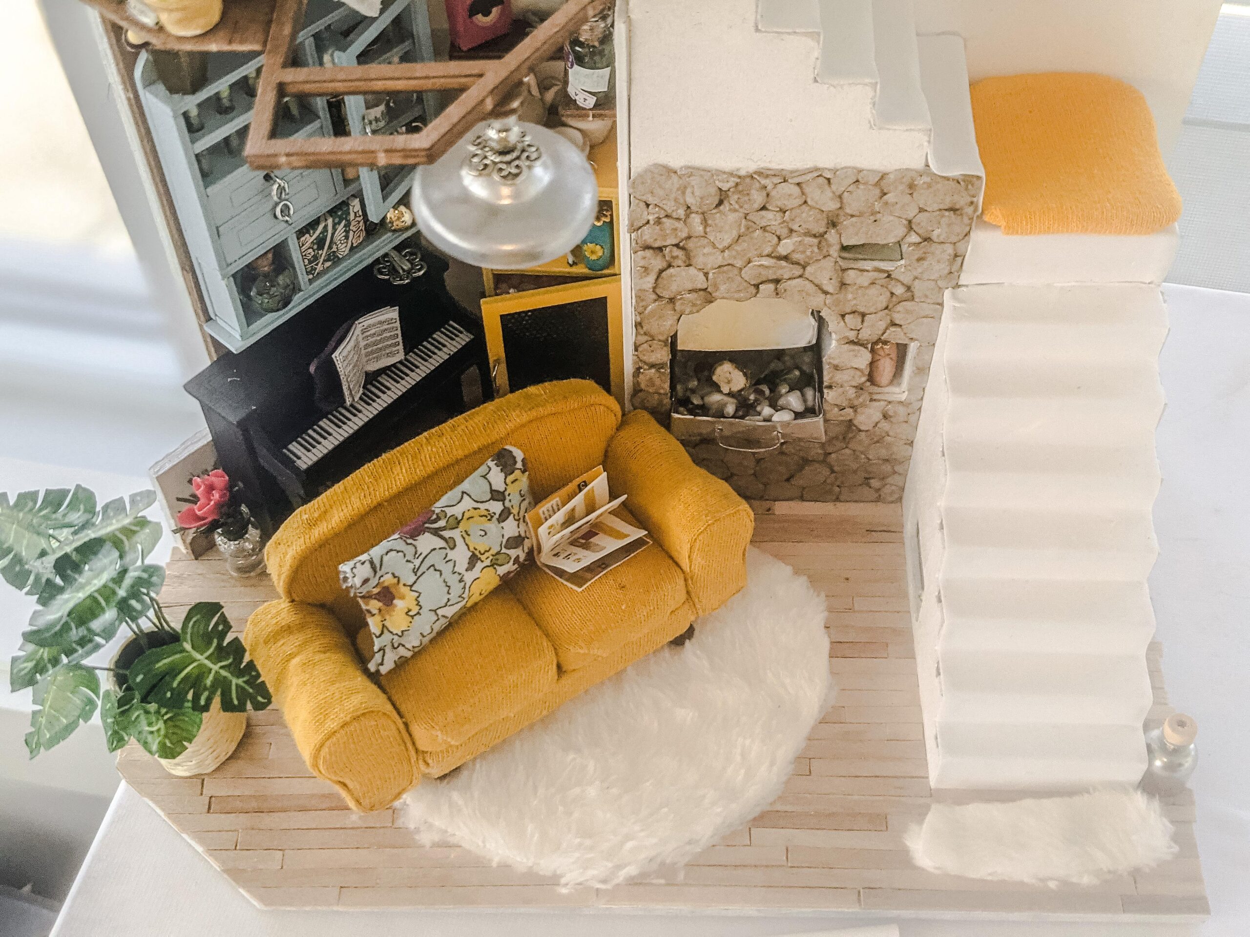 I kind of, sort of fell in love with the egg-carton method of creating natural stone. It's why I reused it in this miniature. I mean, how could I not?
The material for the sofa was an old employee uniform (cleaned!) that i repurposed.