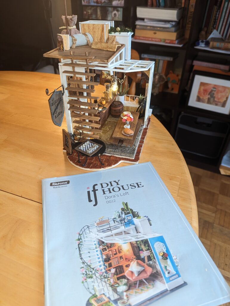 The Rolife Kit used to create the Legends and Lattés scene was Dora's house. It was extensively modified to suit the needs of the scene. On the top floor, we see a roll and a dirty bag, as well as a few construction materials.