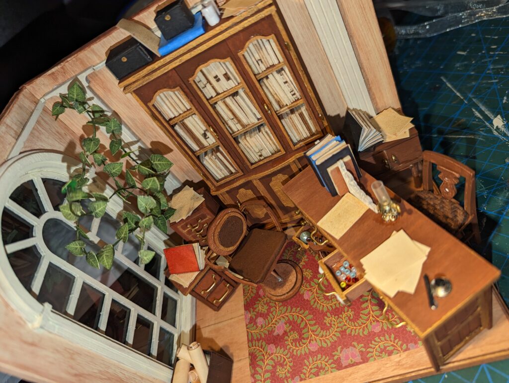 I glued the beads down to prevent anyone from throwing them. This is one of two desk drawers that open and shut.