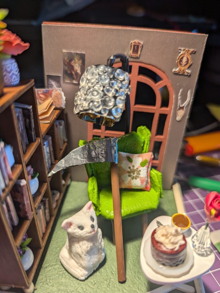 If you visit Michelle Franklin's Patreon and Facebook page, some of the decor may be familiar. 
Of course, I had to include the scythe and the porcelain cat.